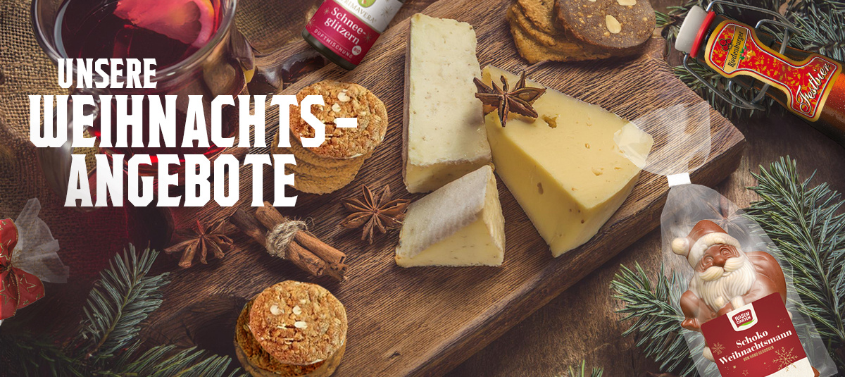 Eine Gruppe von Menschen sitzt an langen Holztischen im Freien bei einer Veranstaltung. In der Bildmitte steht groß geschrieben: „EINLADUNG ZUM HOFFEST“. Auf der linken Seite befindet sich ein rundes, grünes Feld mit dem Text: „mit Jungpflanzen-Kaufen und Tauschen“. Auf den Tischen stehen Teller und Gläser. Im Hintergrund sind weitere sitzende Personen und eine freundliche, gesellige Atmosphäre zu erkennen.